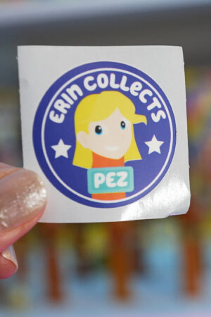 erin collects pez sticker to put on pez dispenser