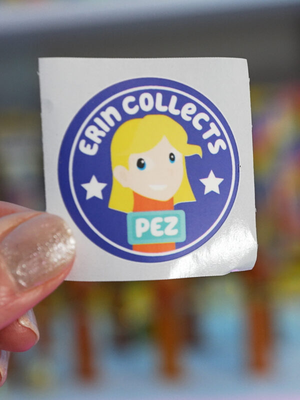 erin collects pez sticker to put on pez dispenser